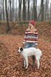 © Laszlo - Young woman posing outdoor with her dog in the forest
