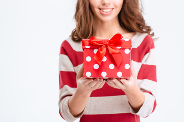 Sticker - Cropped image of a happy woman holding gift box