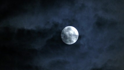 Wall Mural - full moon moving between clouds, 4k