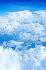 Wall Mural - aerial view of blue sky and cloud top view from airplane window,