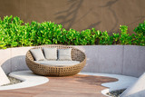 Fototapeta Na drzwi - Relaxing Rattan Sofa In The Garden