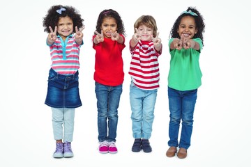 Wall Mural - Smiling kids holding up fingers making peace signs