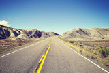 Fototapeta Uliczki - Vintage toned endless country highway, USA