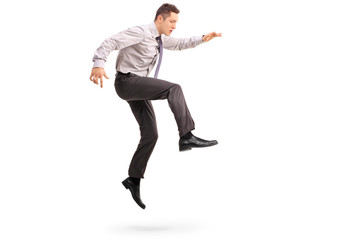 Sticker - Young businessman jumping in the air