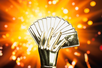 Wall Mural - poker cards trophy against shiny sparks background