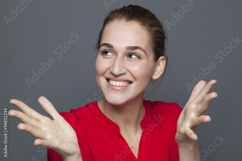 Fotografie, Obraz winning behavior concept - gorgeous 20s girl laughing and gesturing for wellbein