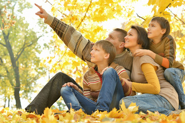 Canvas Print -  Family of four enjoying 