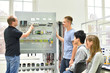 © industrieblick - Jugendliche und Lehrer in der Berufsausbildung für Elektrotechnik // Vocational Training Electrical Engineering