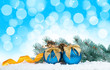 Christmas balls and blue bokeh background.