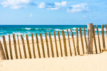 Wooden Fence On An Atlantic Beach In France