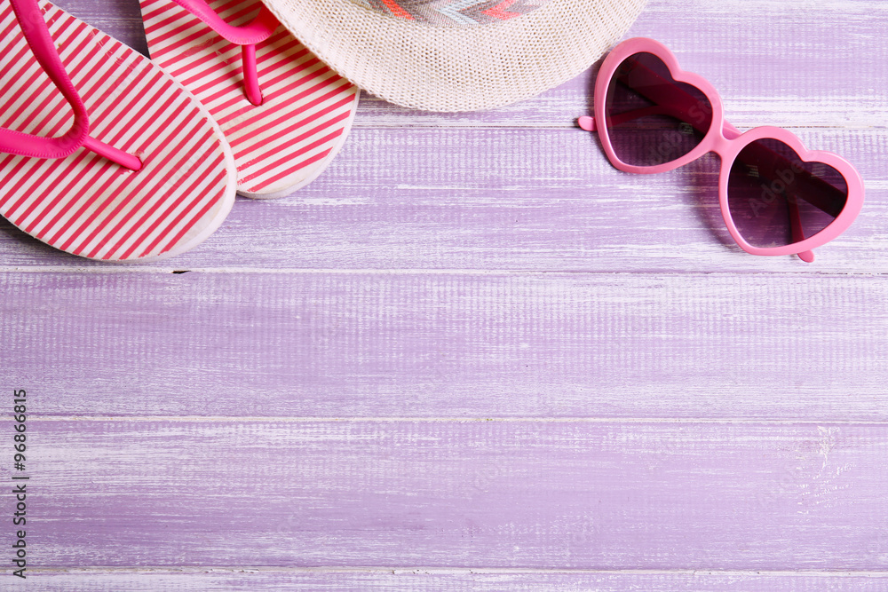 Summer items on wooden background