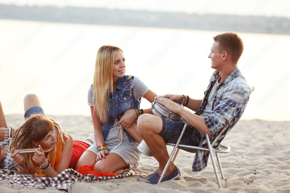 Carefree friends have fun on the beach