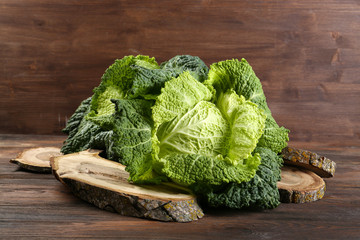 Wall Mural - Savoy cabbage on cutting board closeup