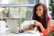 © Africa Studio - Young pretty business woman with laptop in the restaurant drinking coffee