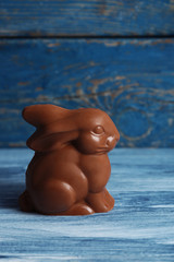 Wall Mural - Chocolate Easter bunny on wooden background