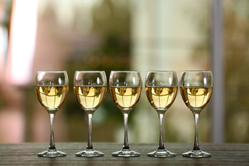 Poster - Wine glasses with wine on a table outside