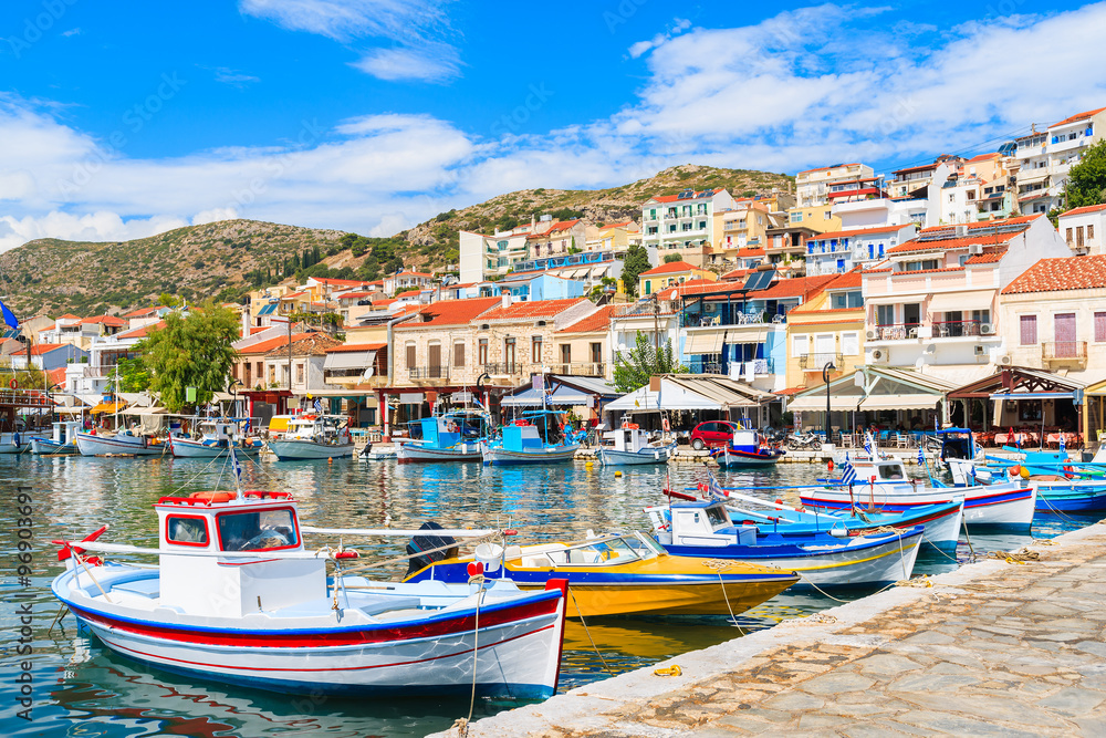 Traditional colourful Greek fishing boats in Pythagorion port, Samos island, Greece - obrazy, fototapety, plakaty 