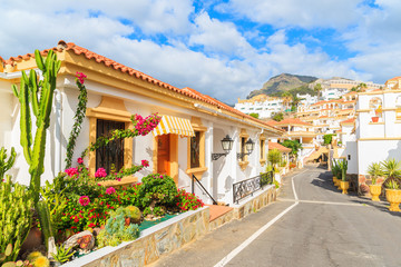 Wall Mural - Street with typical Canary style holiday apartments in Costa Adeje, Tenerife, Canary Islands, Spain