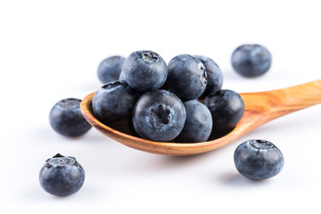 Wall Mural - Fresh blueberries in wooden spoon