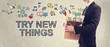 © Tierney - Try New Things concept with Businessman holding box