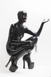 © Richard Semik - sitting woman wearing latex clothes