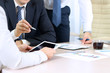 © Saklakova - Business colleagues working and analyzing financial figures on a