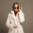 © eugenepartyzan - beautiful girl in fur and sunglasses.winter fashion beauty young woman