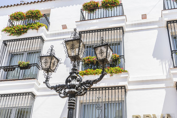 Wall Mural - traditional Andalusian streets with flowers and white houses in