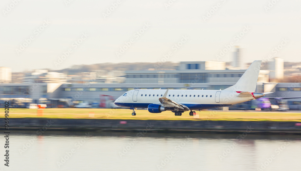 Panning view of an airplane taking off or landing - obrazy, fototapety, plakaty 