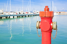 Red Hydrant In A Italian Harbor - Concept Image With Copy Space