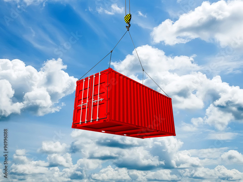 Fotografía Freight shipping container hanging on crane hook