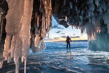 Hiker At The Ice Cave And Across Sunrise.