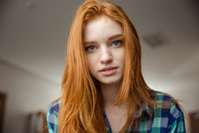 Portrait Of Thoughtful Attractive Redhead Young Woman In Plaid Shirt