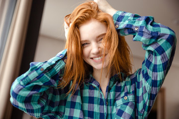 Sticker - Amusing funny girl in checkered shirt with tousled red hair