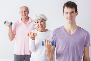 Canvas Print - Elderly couple with personal trainer