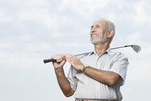 Man Holding A Golf Club