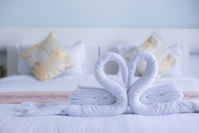 White Swan Twisted Towel Heart Shape On White Bed Ofr Honeymooners, Soft Focus