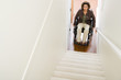© xixinxing - Disabled woman trapped at bottom of stairs