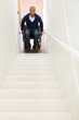 © xixinxing - Disabled man trapped at bottom of stairs