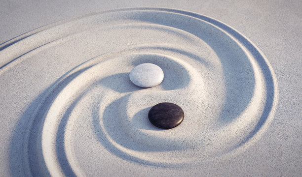 yin yang motiv - steine im sand