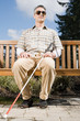 © xixinxing - Blind man sitting on a bench