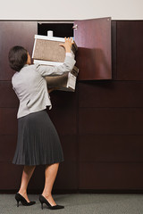 Wall Mural - Businesswoman struggling with files