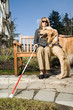 © xixinxing - Blind woman with a guide dog