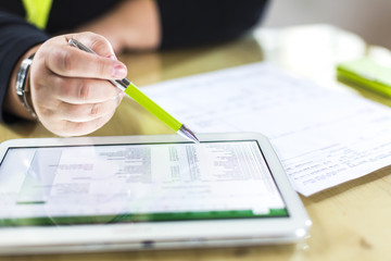 Accounting on a tablet computer, close-up