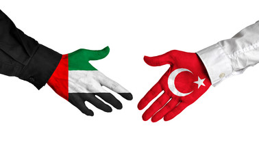 United Arab Emirates and Turkey leaders shaking hands on a deal agreement