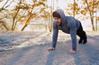 © baranq - Runner doing pushups during morning workout