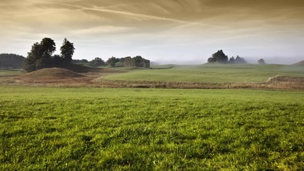 Wall Mural - a beautiful landscape with fog in bavaria germany