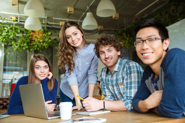 Wall Mural - Group of modern businesspeople having a meeting in conference room