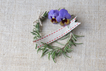 Wall Mural - Rosemary wreath with empty name tag ribbon on linen background