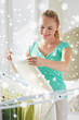© Syda Productions - happy woman hanging clothes on dryer at home